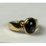 A 14CT GOLD RING SET WITH A BLACK STONE, Weight: 4.0 gms