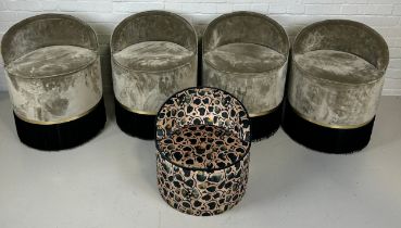 FOUR LOW STOOLS UPHOLSTERED IN GREY VELVET FABRIC WITH FRINGED TASSELS ALONG WITH ANOTHER SMALLER