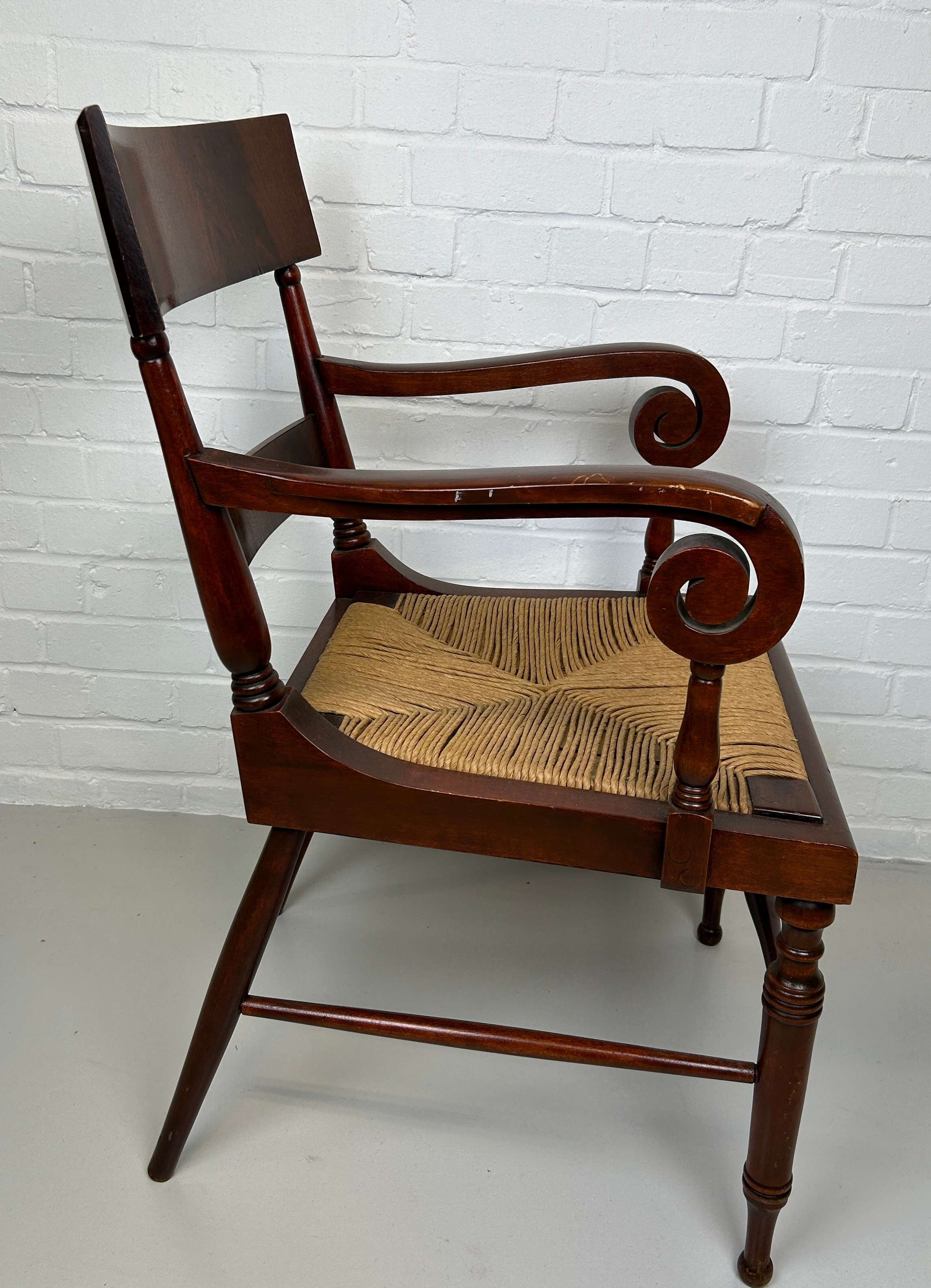 AN EARLY 20TH CENTURY ARMCHAIR OR DESK CHAIR, Flame mahogany with scroll arms and cane upholstered - Image 2 of 4