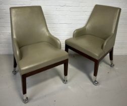 A PAIR OF POKER CHAIRS UPHOLSTERED IN LEATHER FABRIC RAISED ON CHROME CASTORS (2), 95cm x 58cm x
