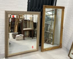 TWO FRENCH STYLE RECTANGULAR WALL MIRRORS, One large gilt wood 136cm x 76cm The other silvered frame