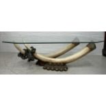 A DECORATIVE 1970'S ITALIAN COFFEE TABLE WITH FAUX RESIN TUSKS AND ROPE TWIST DETAILS ON