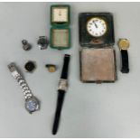 A COLLECTION OF WATCHES AND CLOCKS ALONG WITH A COIN,