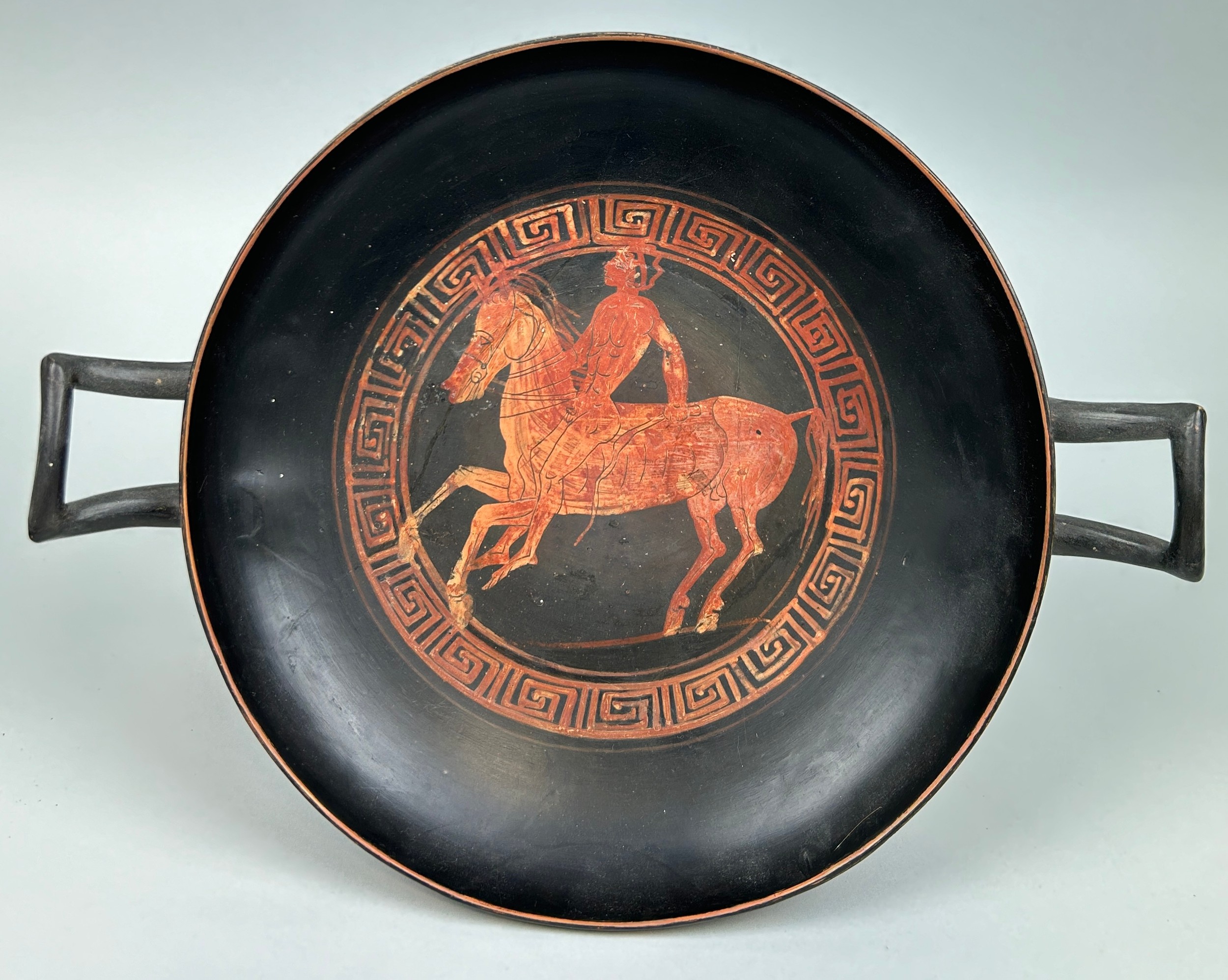 AN APULIAN POTTERY KYLIX DECORATED WITH A HORSE AND RIDER CIRCA 5TH CENTURY B.C. - Image 10 of 10