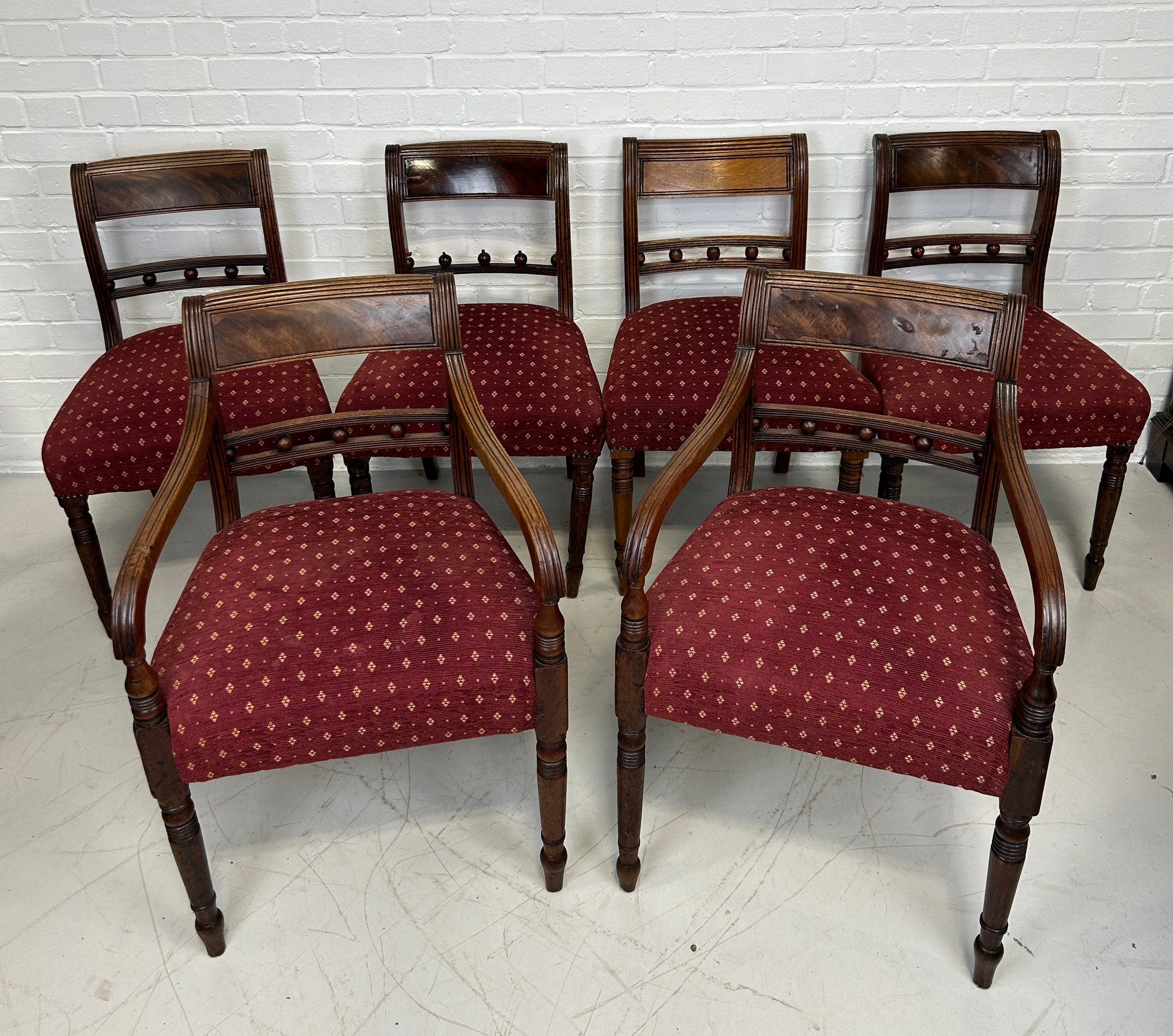 A SET OF SIX REGENCY DINING CHAIRS, To include two carvers and four side chairs. Carvers 82cm x 54cm