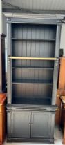 A TALL EBONISED SECTIONAL BOOKCASE, 240cm x 100cm x 40cm