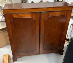 A MAHOGANY CUPBOARD OF SHALLOW PROPORTIONS WITH TWO SWING DOORS, 109cm x 100cm x 27cm