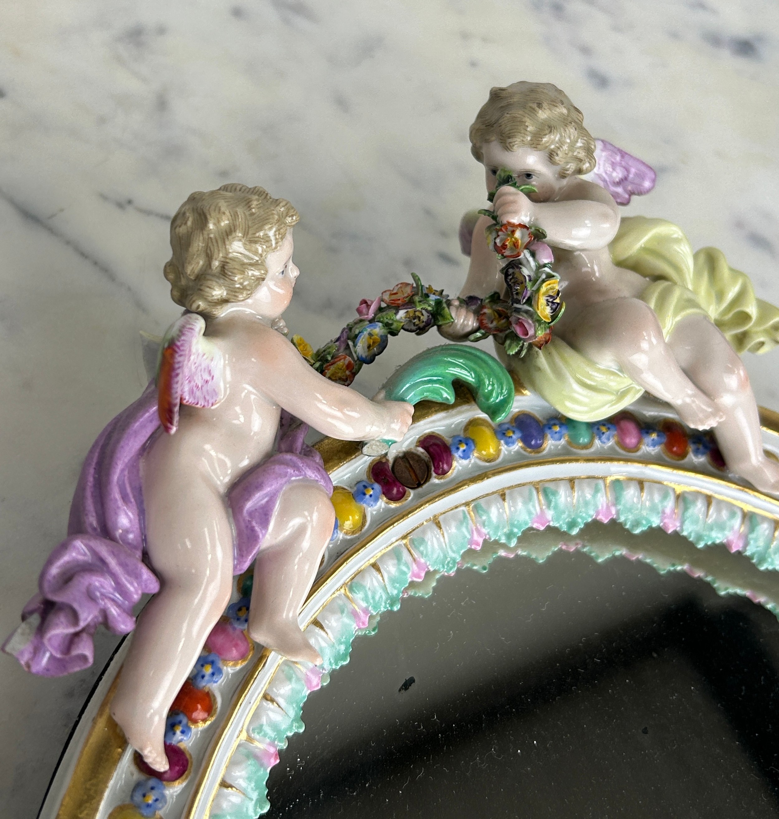 A MEISSEN PORCELAIN MIRROR WITH WINGED PUTTI CREST AND FLORAL BORDER, 34cm x 24cm - Image 3 of 6