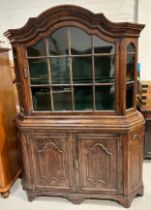 A LARGE 19TH CENTURY OAK DRESSER WITH GLAZED GLASS PANELS OVER TWO DOORS, Green lined interior and