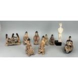 A SCULPTURE AFTER HENRY MOORE ALONG WITH A COLLECTION OF KARAJA TRIBE POTTERY FIGURES (9) Some