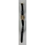 AN ANTIQUE 9CT GOLD WATCH WITH BLACK LEATHER STRAP, Weight 12.9gms