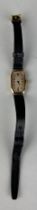 AN ANTIQUE 9CT GOLD WATCH WITH BLACK LEATHER STRAP, Weight 12.9gms