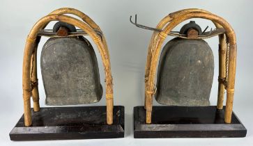 A PAIR OF BUDDHIST BRONZE ELEPHANT BELLS OR GONGS AND A SINGING BOWL (3), Each gong 43cm x 38cm