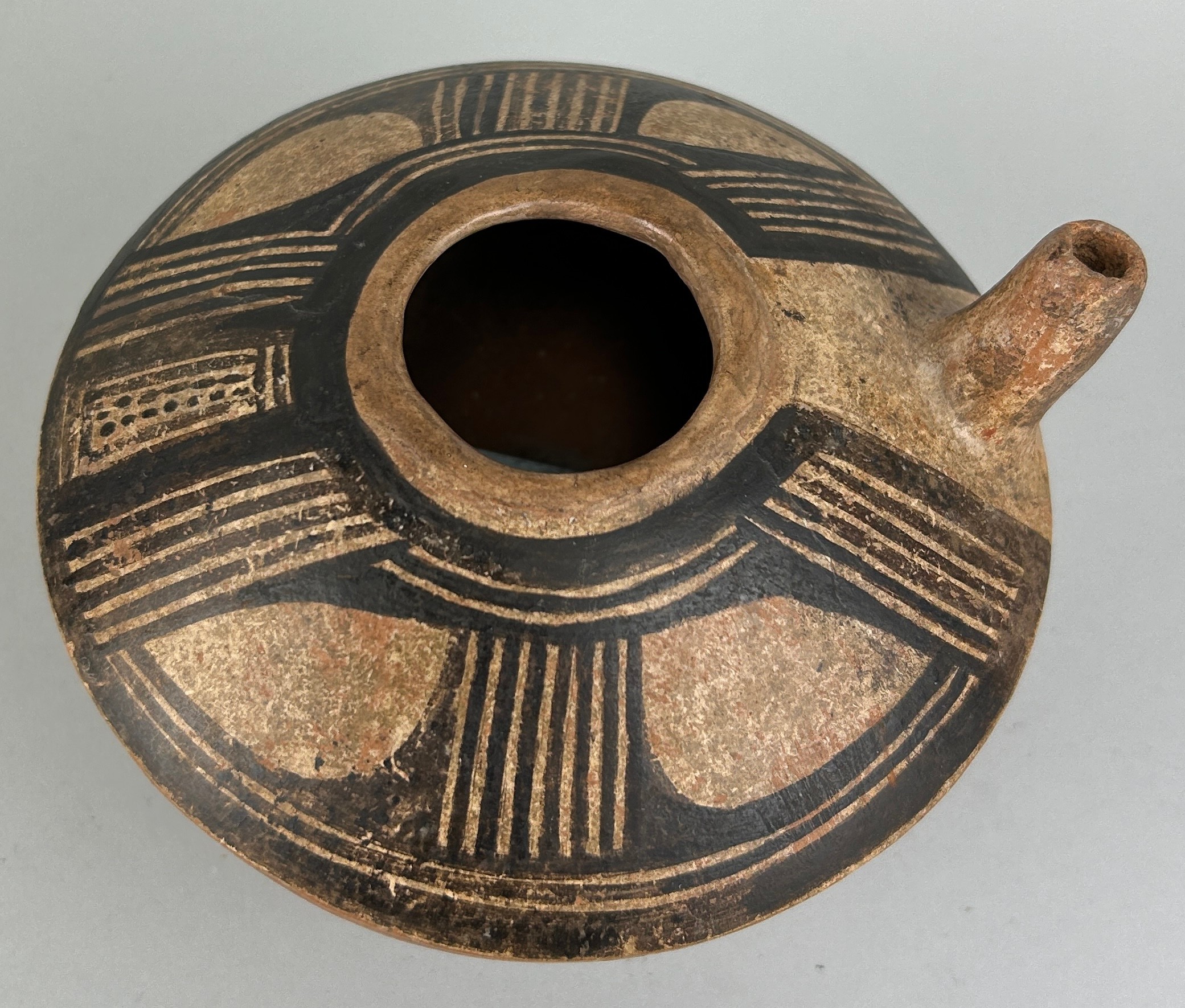 A PRE COLUMBIAN VERAGUAS TERRACOTTA AND PIGMENT VESSEL WITH SPOUT, From Costa Rica / Panama,