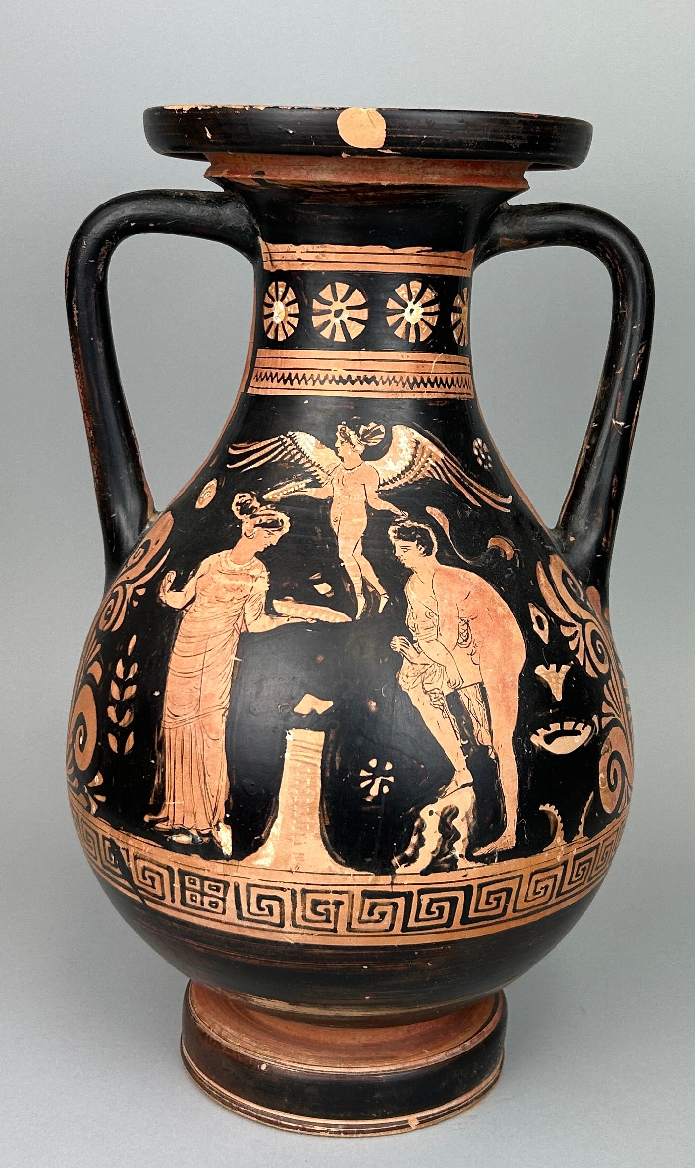 AN APULIAN POTTERY PELIKE CIRCA 4TH CENTURY B.C. 39cm x 21cm One side depicts a young man and