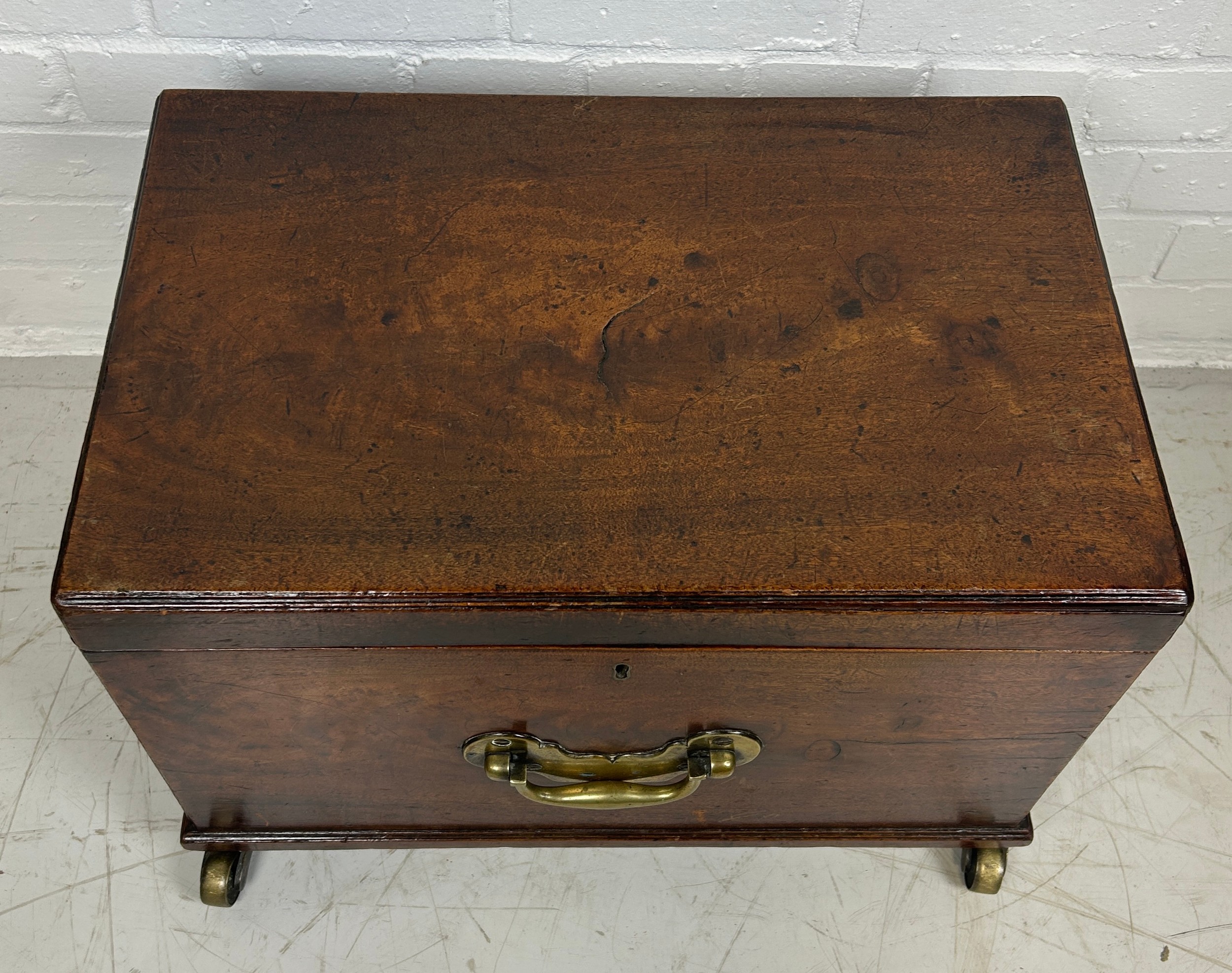 A GEORGE III MAHOGANY CELLARETTE, With fitted interior, brass handles and brass castors. 54cm x 38cm - Image 2 of 4