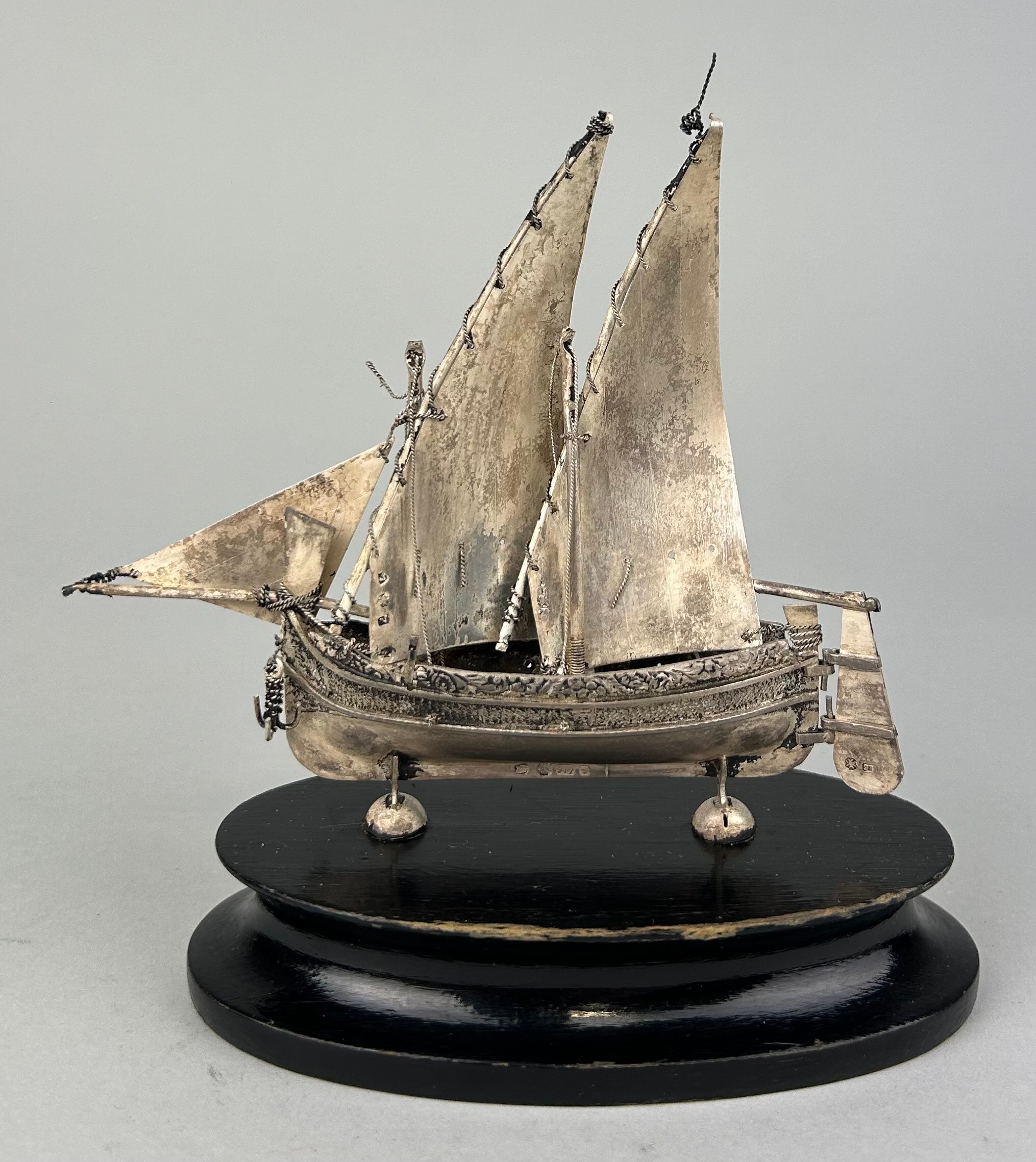 A SILVER JUNK SHIP MOUNTED ON STAND, 12cm x 12cm including stand. - Image 2 of 3