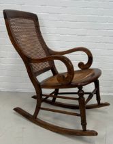 A 19TH CENTURY ROCKING CHAIR WITH CANED BACK AND SEAT, 92cm x 72cm x 53cm