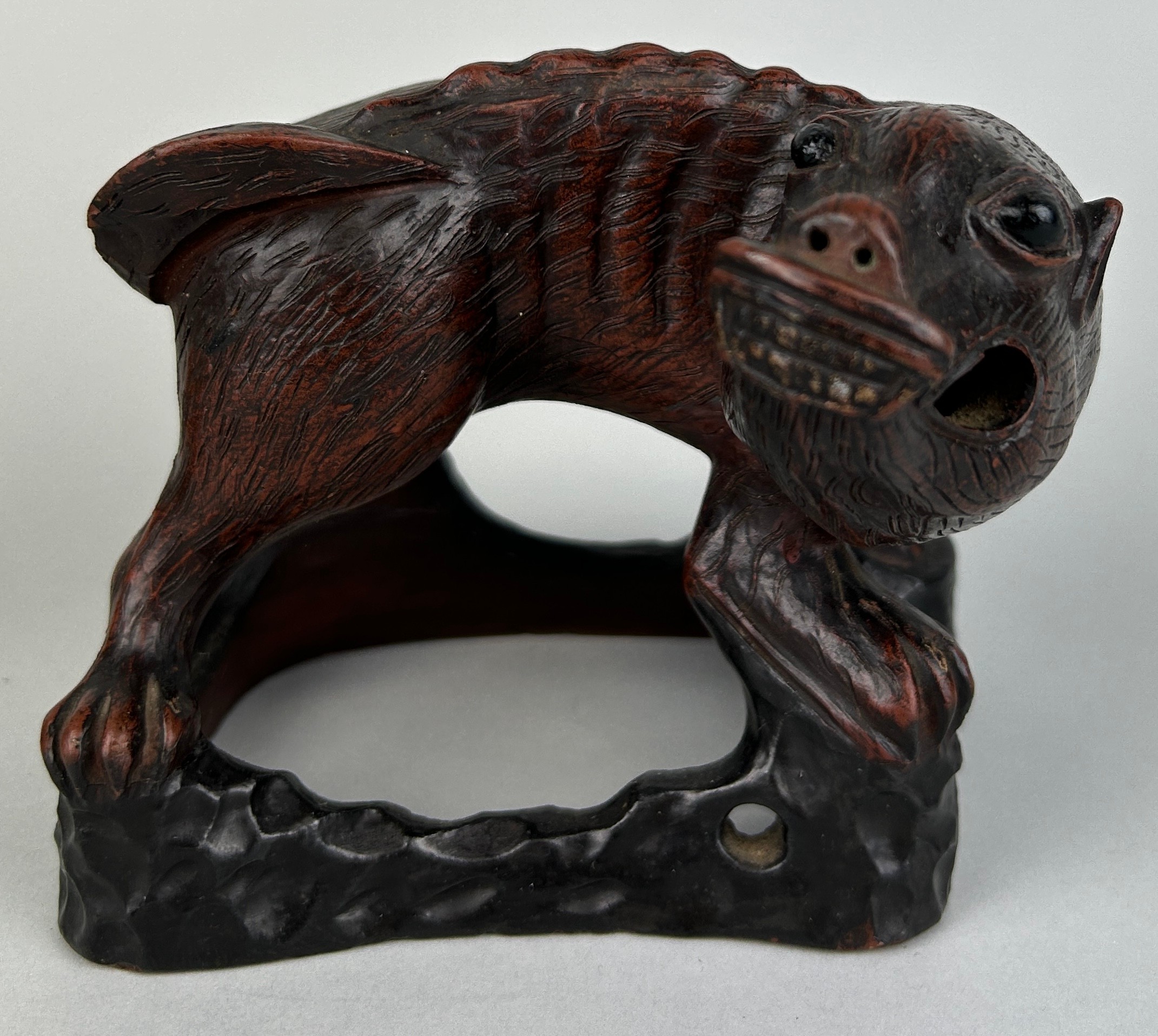 A CHINESE METAL FIGURE OF A LION, 13cm x 11cm