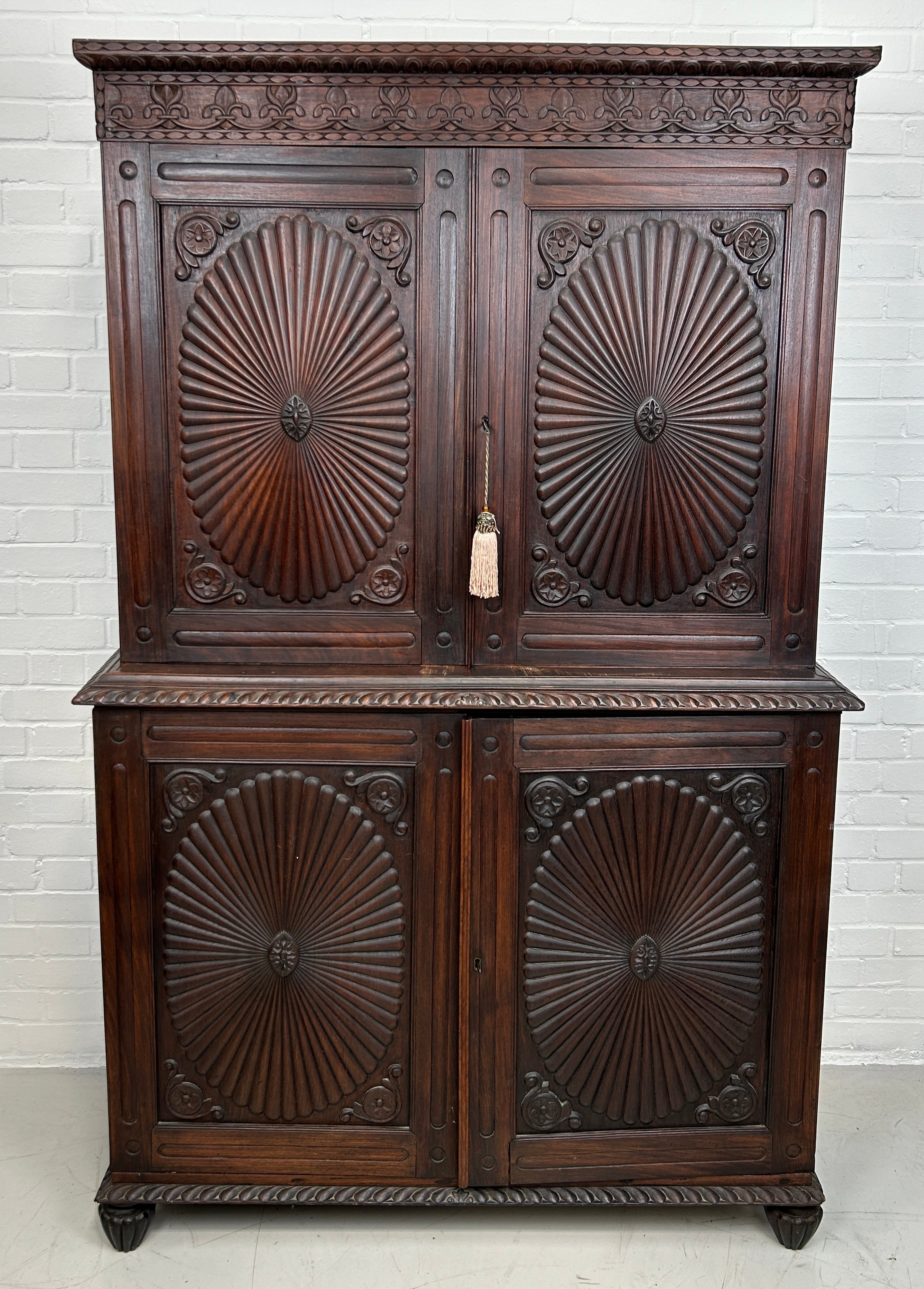 A 19TH CENTURY ANGLO INDIAN ROSEWOOD SECTIONAL WARDROBE WITH SUNBURST DESIGN PANELS, 194cm x 120cm x