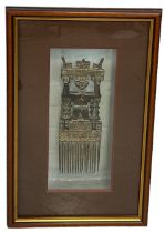 AN ANTIQUE AFRICAN BRONZE COMB, 30cm x 10cm Mounted in a glass display case and glazed. 56cm x 34cm