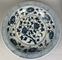 A CHINESE MING STYLE CHARGER DECORATED WITH FLOWERS, 40cm x 8cm