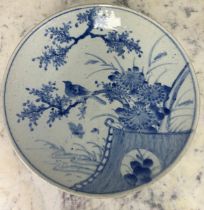 A LARGE JAPANESE BLUE AND WHITE PLATE DECORATED WITH BIRDS AND FOLIAGE, 42cm D