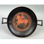 AN APULIAN POTTERY KYLIX DECORATED WITH A HORSE AND RIDER CIRCA 5TH CENTURY B.C.
