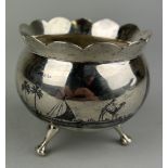 AN ARABIC SILVER BOWL ON TRIPOD STAND, Nielo decorated with palm trees. Signed to the side. Weight