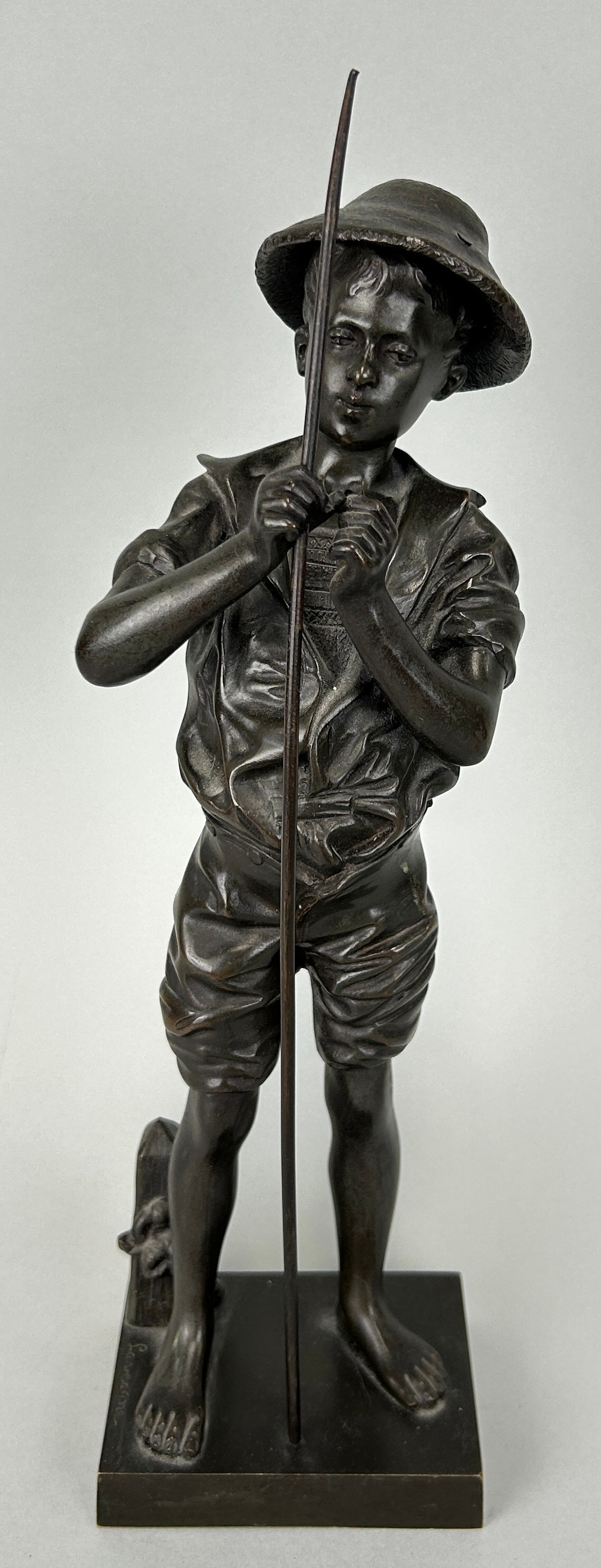 AFTER ADOLPH LAVERGNE: A BRONZE FIGURE OF A BOY FISHING, 32cm H