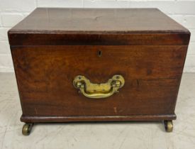 A GEORGE III MAHOGANY CELLARETTE, With fitted interior, brass handles and brass castors. 54cm x 38cm