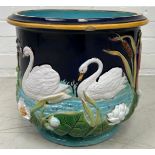 A GEORGE JONES MAJOLICA JARDINIERE DECORATED WITH SWANS, 37cm x 30cm