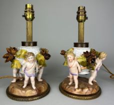 A PAIR OF DRESDEN PORCELAIN TABLE LAMPS, DEPICTING WINGED PUTTI, FLORA AND FAUAN, 29cm H each.