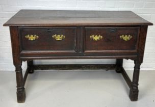A CHARLES II OAK DRESSER WITH TWO DRAWERS RAISED ON FOUR LEGS JOINED WITH A STRETCHER, 130cm x