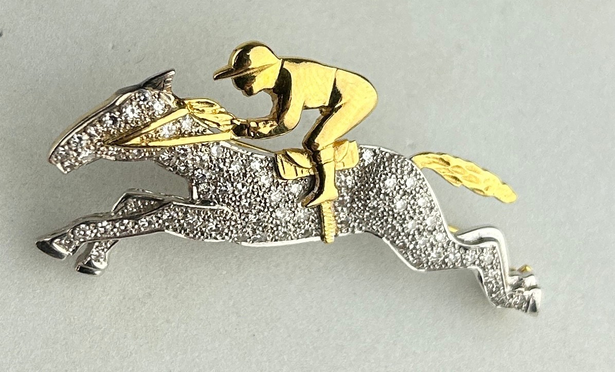 AN 18CT GOLD AND DIAMOND HORSE AND JOCKEY BROOCH, The brooch measures 4.7cm x 2.4cm. - Image 2 of 3