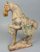 A CHINESE POTTERY HORSE FIGURE IN THE TANG STYLE, 35cm x 30cm