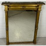 A REGENCY GILT WOOD WALL MIRROR, 93cm x 72cm Classical columns with floral capitals.