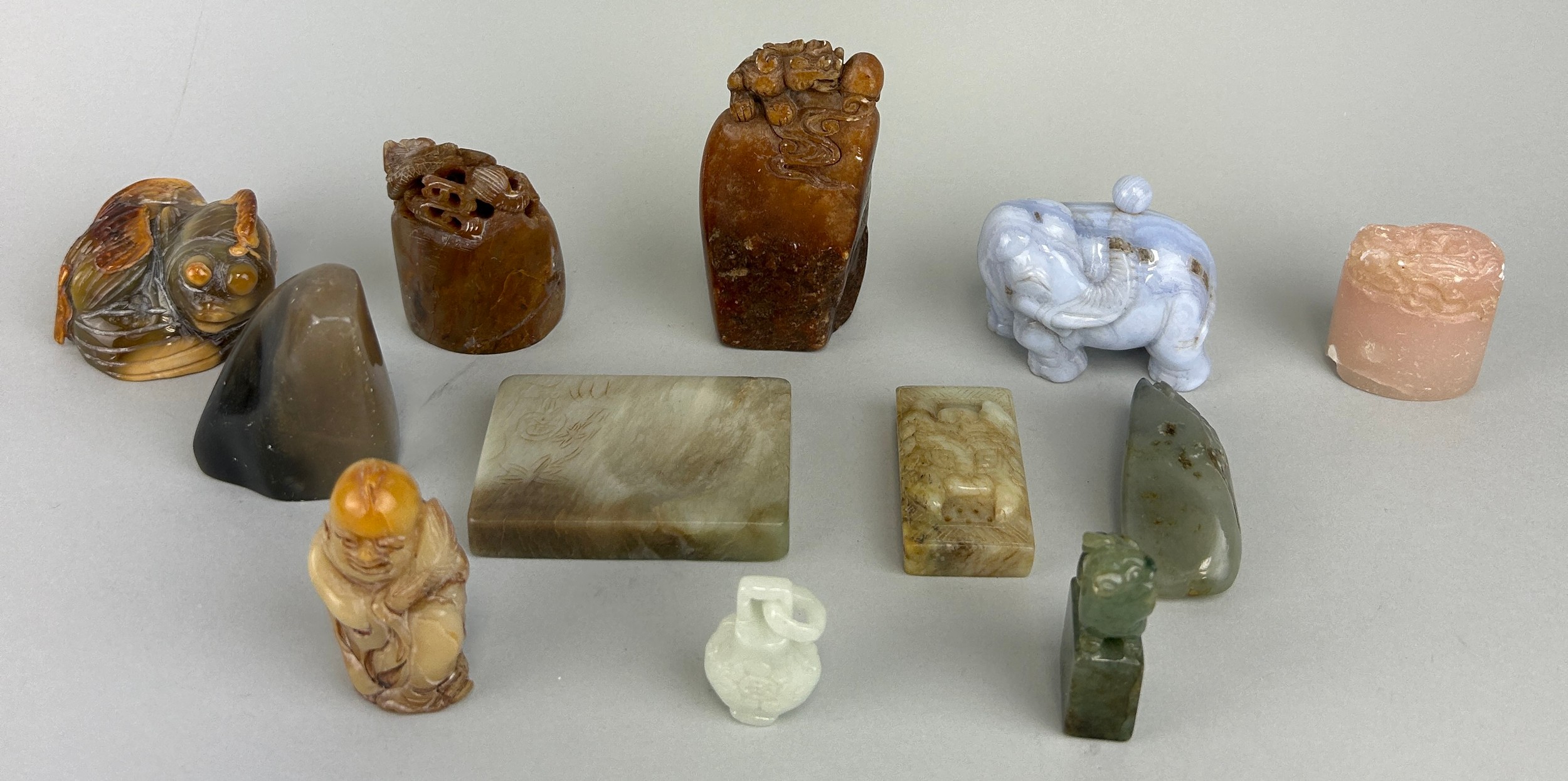 A COLLECTION OF CHINESE / ASIAN STONE AND JADE SEALS AND OTHER ITEMS (12) Largest 9cm H