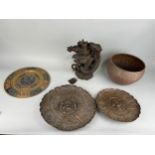 A GROUP OF THREE ISLAMIC METAL TRAYS ALONG WITH A JAPANESE CARVED WOODEN SCULPTURE AND AN INDIAN