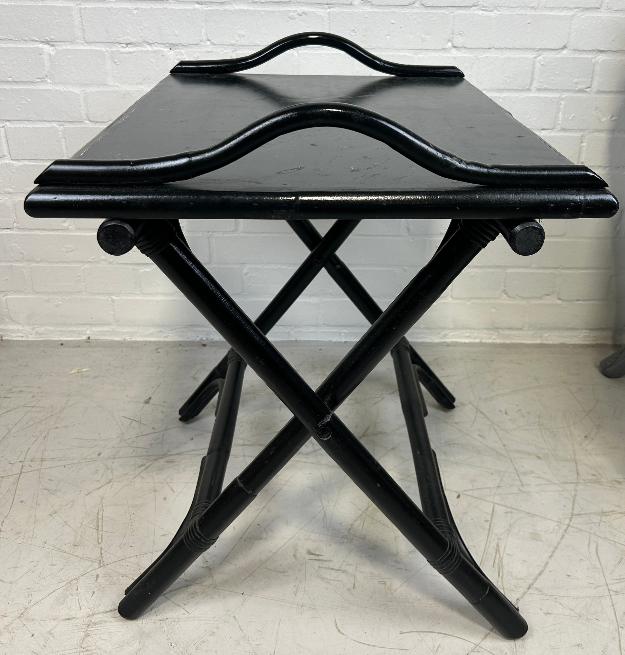 AN EBONISED BUTLERS STAND, 65cm x 60cm x 50cm