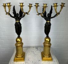 A PAIR OF FRENCH EMPIRE DESIGN EARLY 20TH CENTURY GILT AND BRONZE FOUR-LIGHT CANDELABRA IN THE