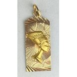 EGYPTIAN REVIVAL: A GOLD PENDANT WITH BUST OF NEFERTITI, Weight 5.7gms