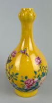 A CHINESE YELLOW GLAZED BOTTLE VASE PAINTED WITH BIRDS AND FLOWERS, WITH A POEM TO ONE SIDE, 15cm