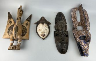 A GROUP OF FOUR AFRICAN TRIBAL MASKS (4), One labelled 'early 20th Century Dogon tribe mask' (56cm x