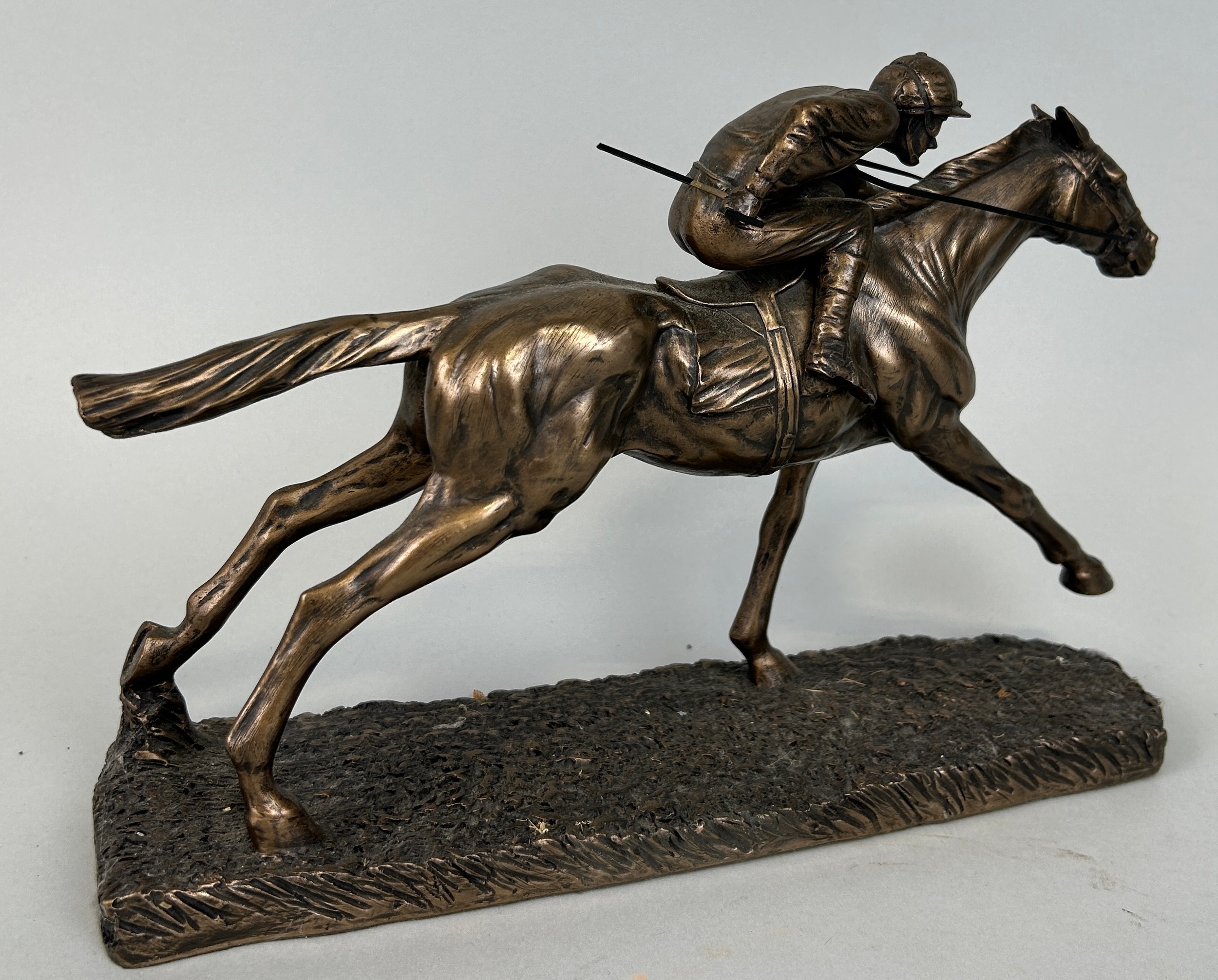 A BRONZED METAL SCULPTURE DEPICTING A JOCKEY ON A RACEHORSE, 28cm x 19cm - Image 2 of 3