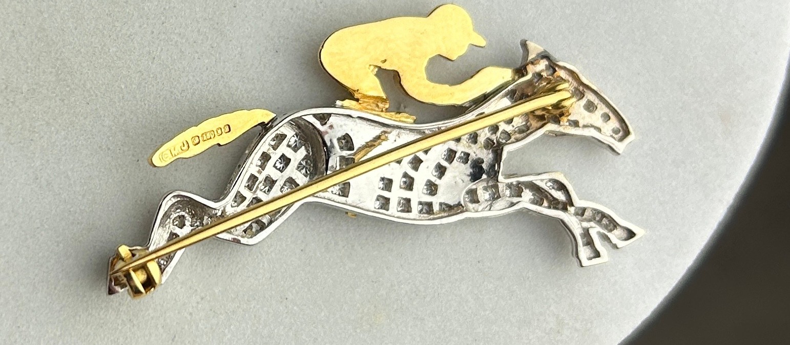 AN 18CT GOLD AND DIAMOND HORSE AND JOCKEY BROOCH, The brooch measures 4.7cm x 2.4cm. - Image 3 of 3