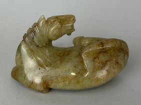 A CHINESE CARVED JADE FIGURE OF A HORSE, 8cm x 4cm