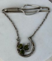 A SILVER PIN WITH CLOVER, IN ANTIQUE CASE.