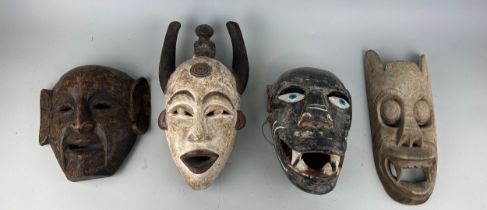 A GROUP OF FOUR AFRICAN TRIBAL MASKS (4),