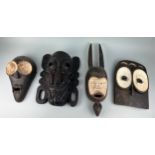 A GROUP OF FOUR AFRICAN TRIBAL MASKS (4), Largest 54cm x 15cm